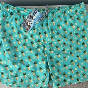 NWT 2XL pineapple swim trunks with drawstring and mesh lining. Fast drying.